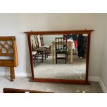 A vintage mahogany overmantel mirror, 20th century, with a bevelled rectangular plate and fluted