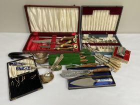 Assorted flatware, including assorted carving sets, serving spoons and related items (a lot)