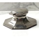 A silver capstan inkwell, hallmarked Chester 1936, with hinged lid, inset glass well, and