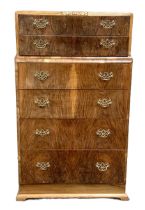 A vintage burr walnut chest of drawers, with six graduated and stepped drawers, 131cm high