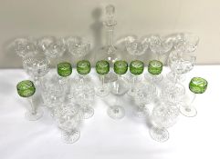A collection of assorted glassware, including a Regency style decanter, a set of flashed green