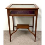 An Edwardian mahogany bijouterie table, early 20th century, with glazed and satinwood banded