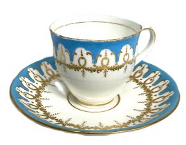 A Royal Worcester part coffee service, decorated with blue celeste and ornate gilt borders; also