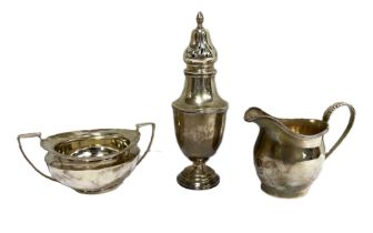 Assorted silver, including a modern cream jug, hallmarked Chester, 1939, with leaf capped handle;