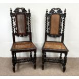A pair of late Victorian oak framed hall chairs, with vine carved crests and caned seats; also two