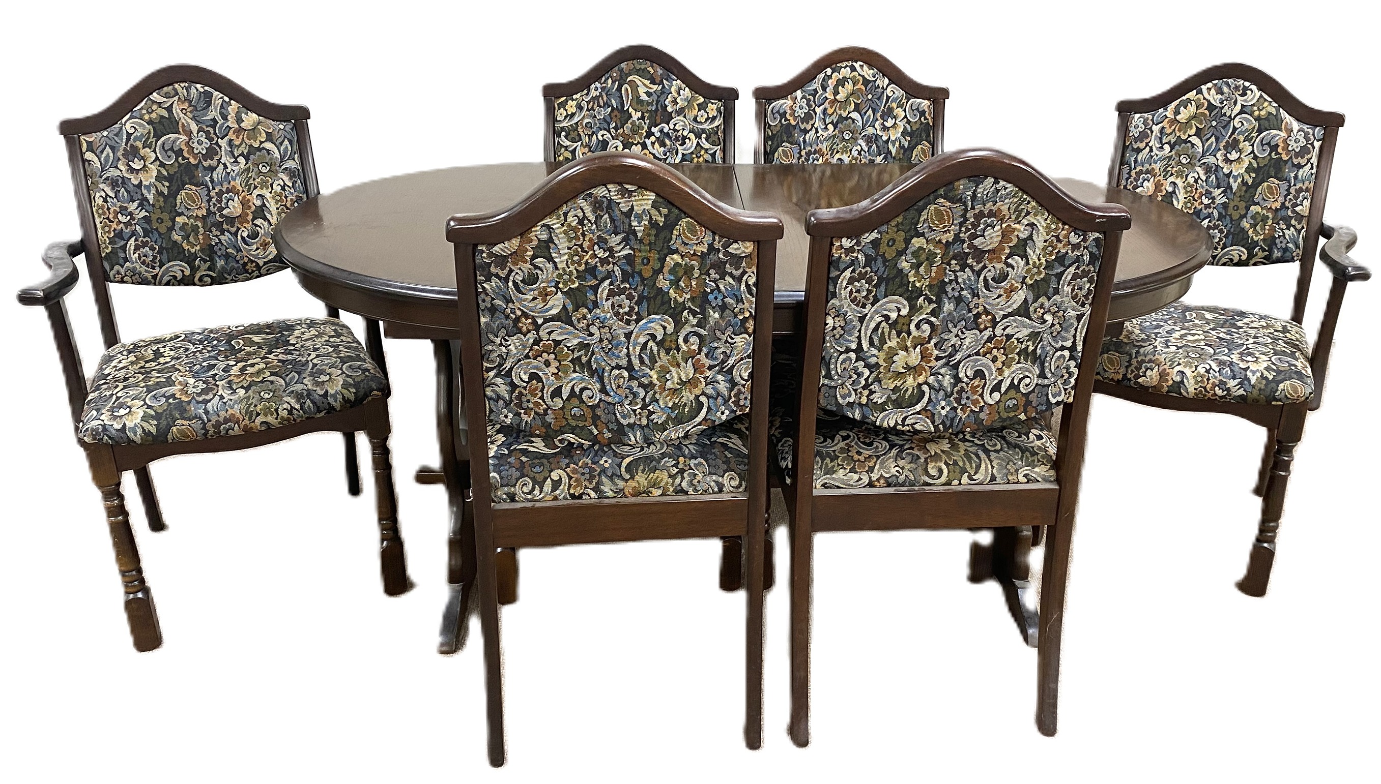 A modern beech wood extending dining table and set of six matching chairs, including two armchairs,