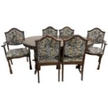 A modern beech wood extending dining table and set of six matching chairs, including two armchairs,