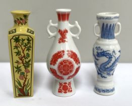 A large collection of miniature vases and ornaments, including a flower encrusted slipper, various