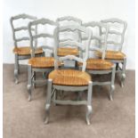 A set of six grey painted rush seated dining chairs, with shaped ladder backs (6)