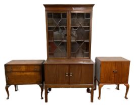 A George III style mahogany bookcase, with a pair of glazed doors over a two door cabinet, 178cm