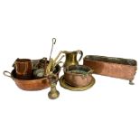 A selection of brass and copper wares, including a graduated set of saucepans, assorted planters,