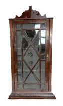 A George III style mahogany wall mounted corner cabinet, with single glazed door.  69cm wide, 41cm