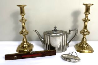 A pair of brass ejector candlesticks, together with a pewter teapot, a Smallwood brass faced