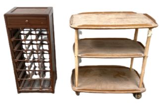 An Ercol ash wood three tier serving trolley, 71cm wide; also an 18 bottle wine rack, with corkscrew