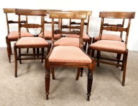 A harlequin set of eight Regency rosewood dining chairs, circa 1820,  all with curved bar backs,