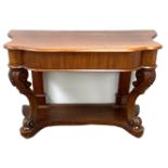 A Victorian mahogany console table, with shaped top and cabriole front legs and a platform