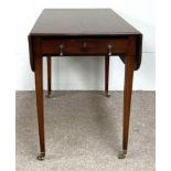 A Regency style mahogany Pembroke table, with drop leaf top and single end drawer, set on tapered