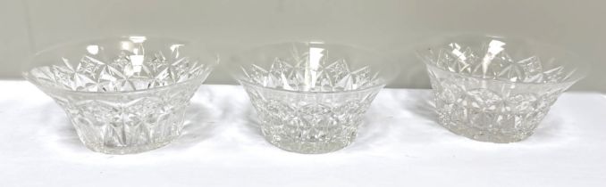 A large assortment of table glassware, including various crystal wine glasses and a set of eleven