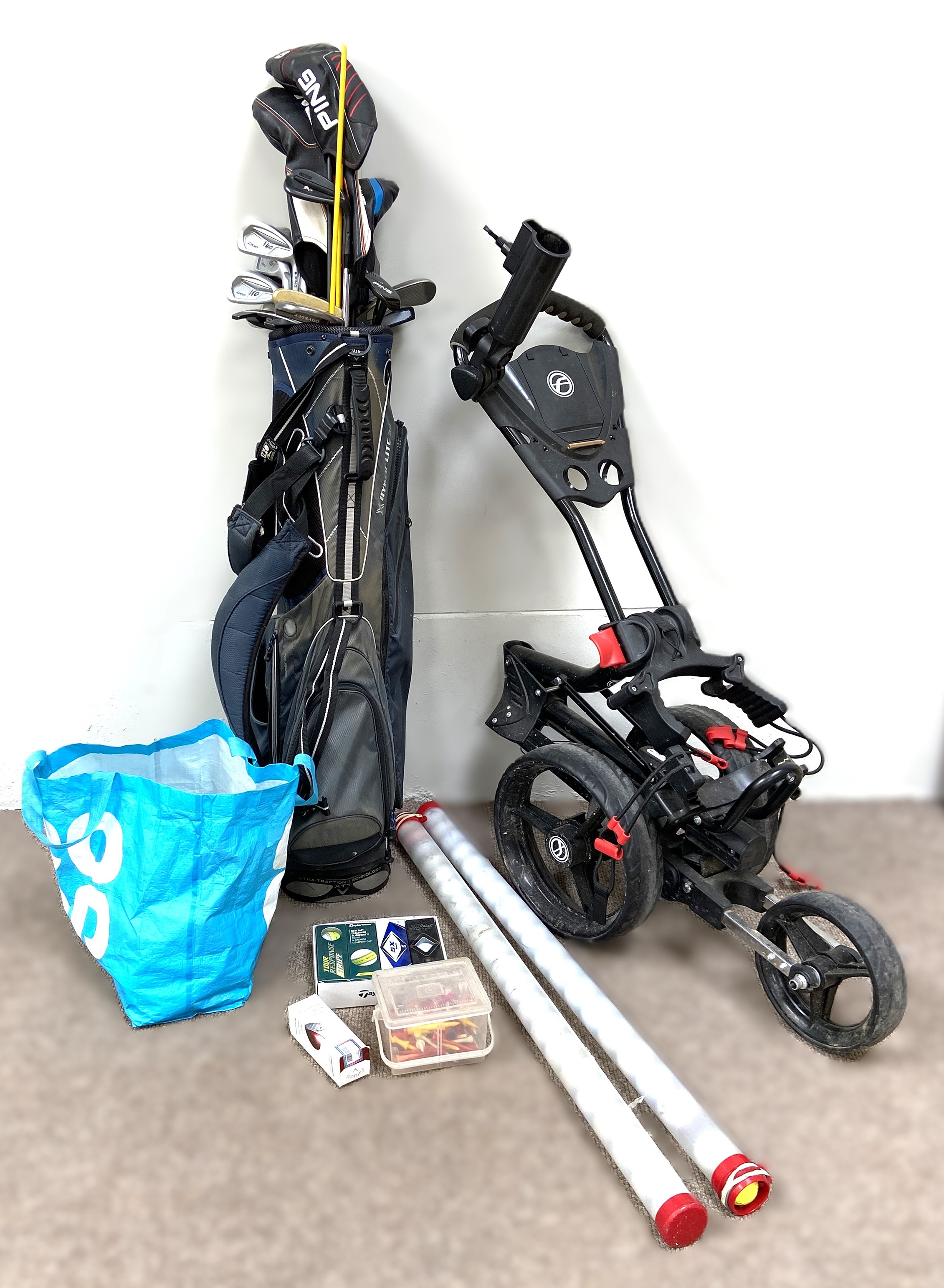 GOLF: A gold bag and folding golf trollley and assorted clubs, including Ping Cadence TR putter etc.