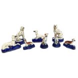 A group of assorted Staffordshire figures of Dalmatian dogs and Greyhounds, in various sizes and