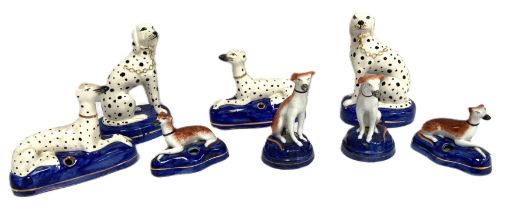 A group of assorted Staffordshire figures of Dalmatian dogs and Greyhounds, in various sizes and