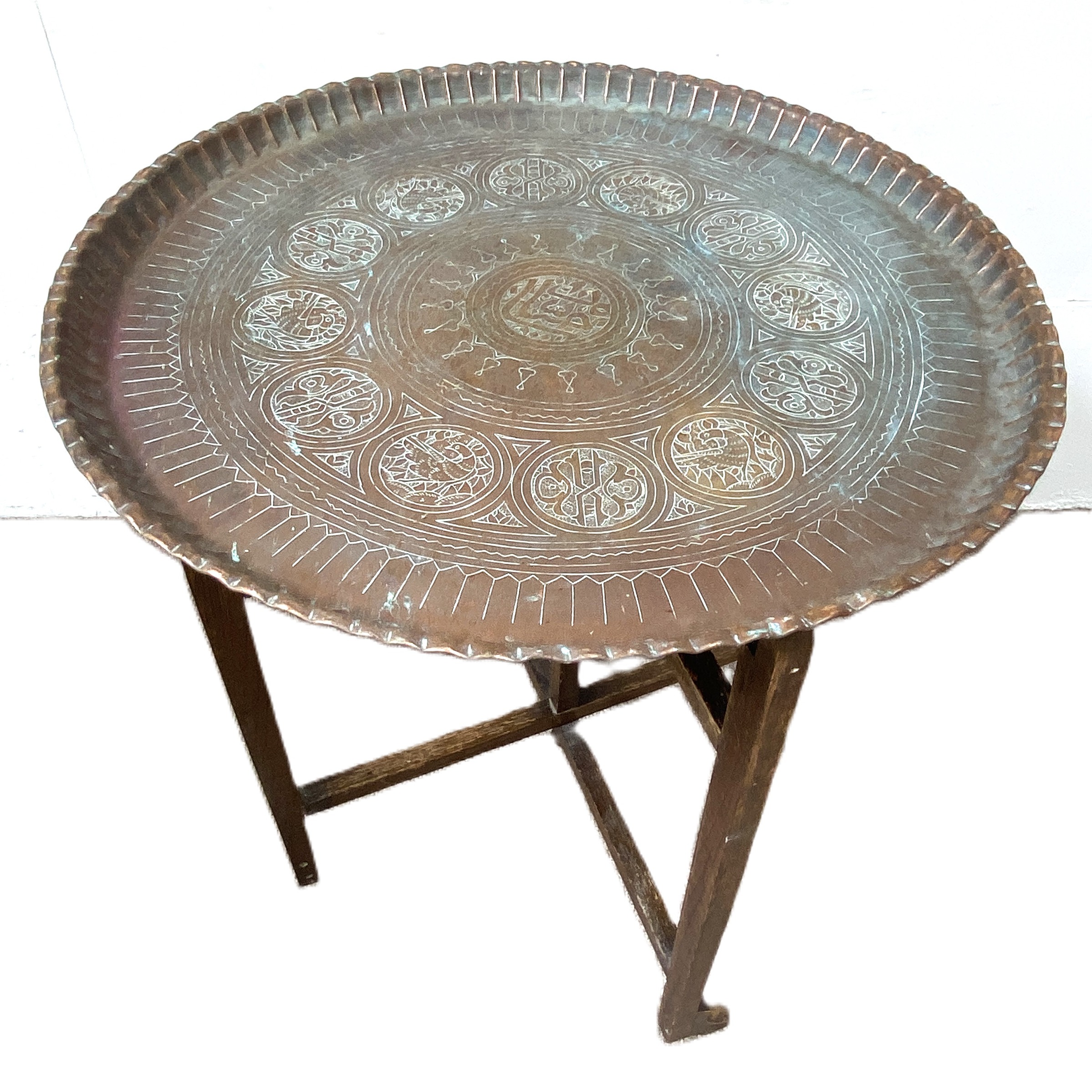 An embossed Islamic copper tray and associated folding stand, 72cm diameter; also a group of baskets - Image 2 of 4