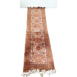 A modern Caucasian style runner, decorated with medallions on a light grey ground, 220cm long