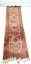 A modern Caucasian style runner, decorated with medallions on a light grey ground, 220cm long