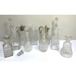 A group of vintage glass decanters, including two silver plate mounted claret jugs; a mallet