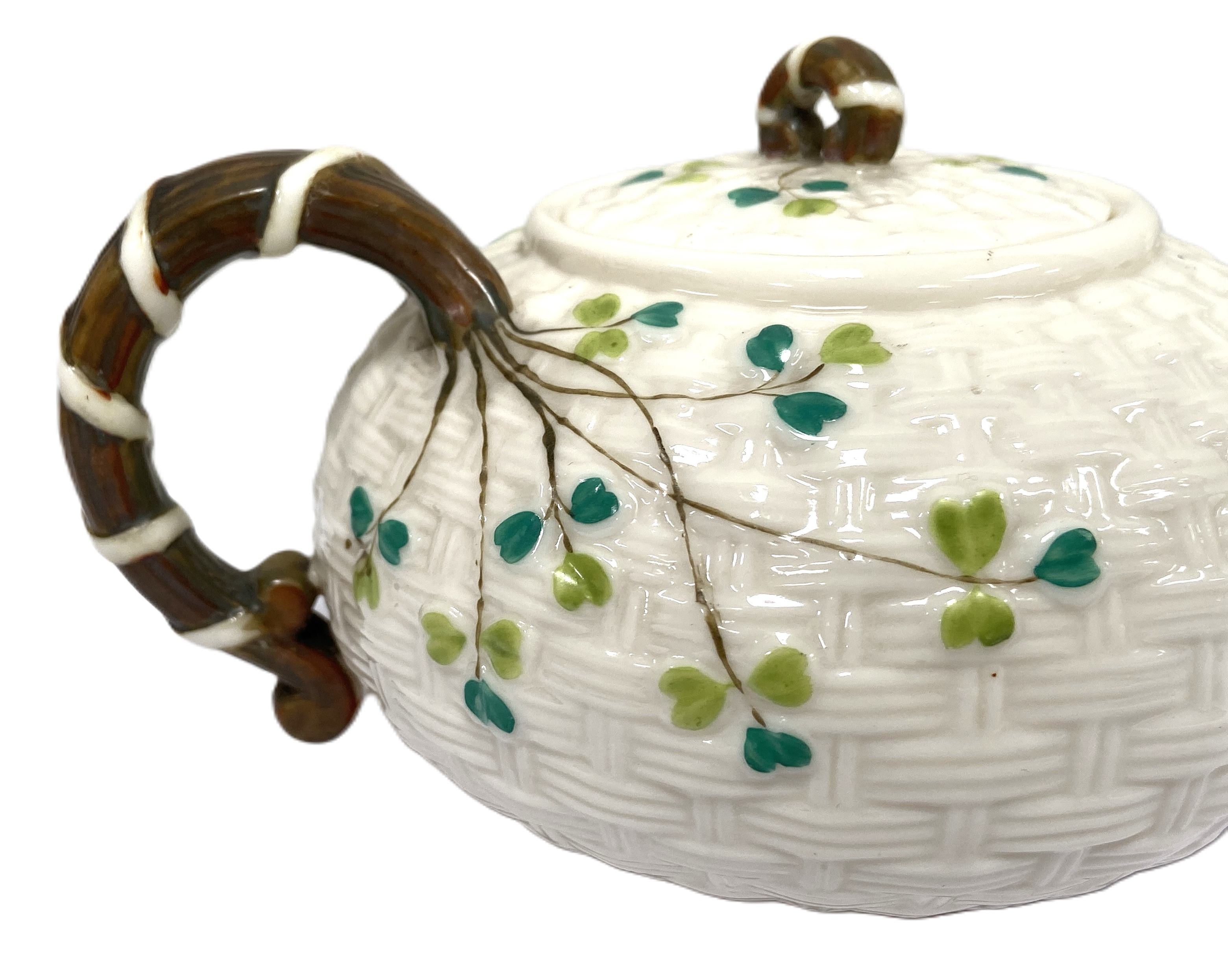 An Irish Belleek part tea service, circa 1900, the teapot with 'basket weave' embossed sides and - Image 7 of 8