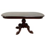 A Victorian style mahogany breakfast table, 20th century, with an oval top on a leaf capped baluster