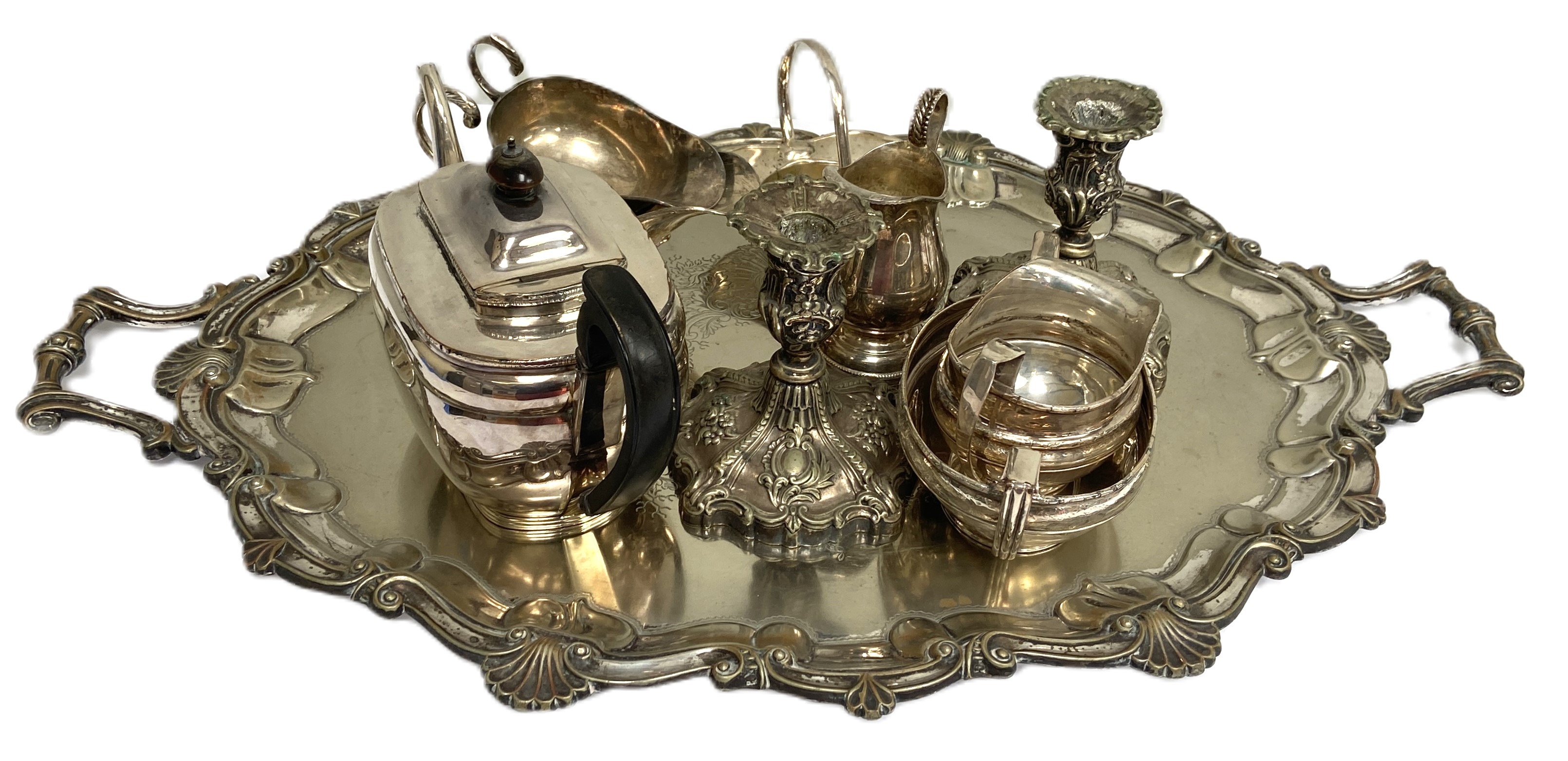 A quanity of silver plate, including a large two handled tea tray; a pair of squat embossed