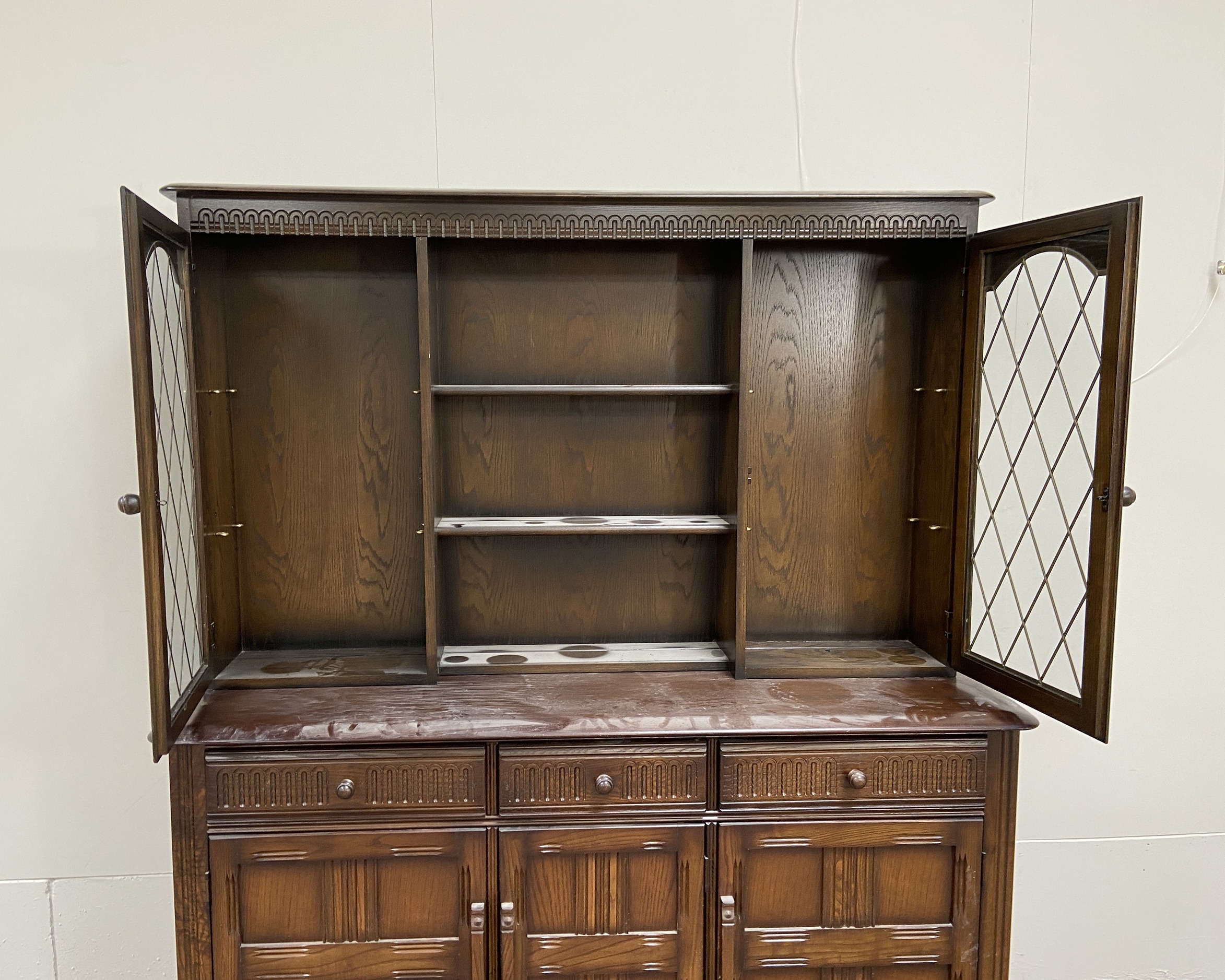 A vintage oak Jacobean style dresser, 20th century, the top with glazed cabinets and pot shelves, - Image 3 of 5