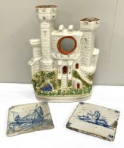 Two Dutch Delft tin glazed blue and white decorated tiles (apparently found in an Amsterdam cellar);