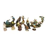 A collection or ceramic figures of birds, including a Goebel porcelain figure of a Jay; also two