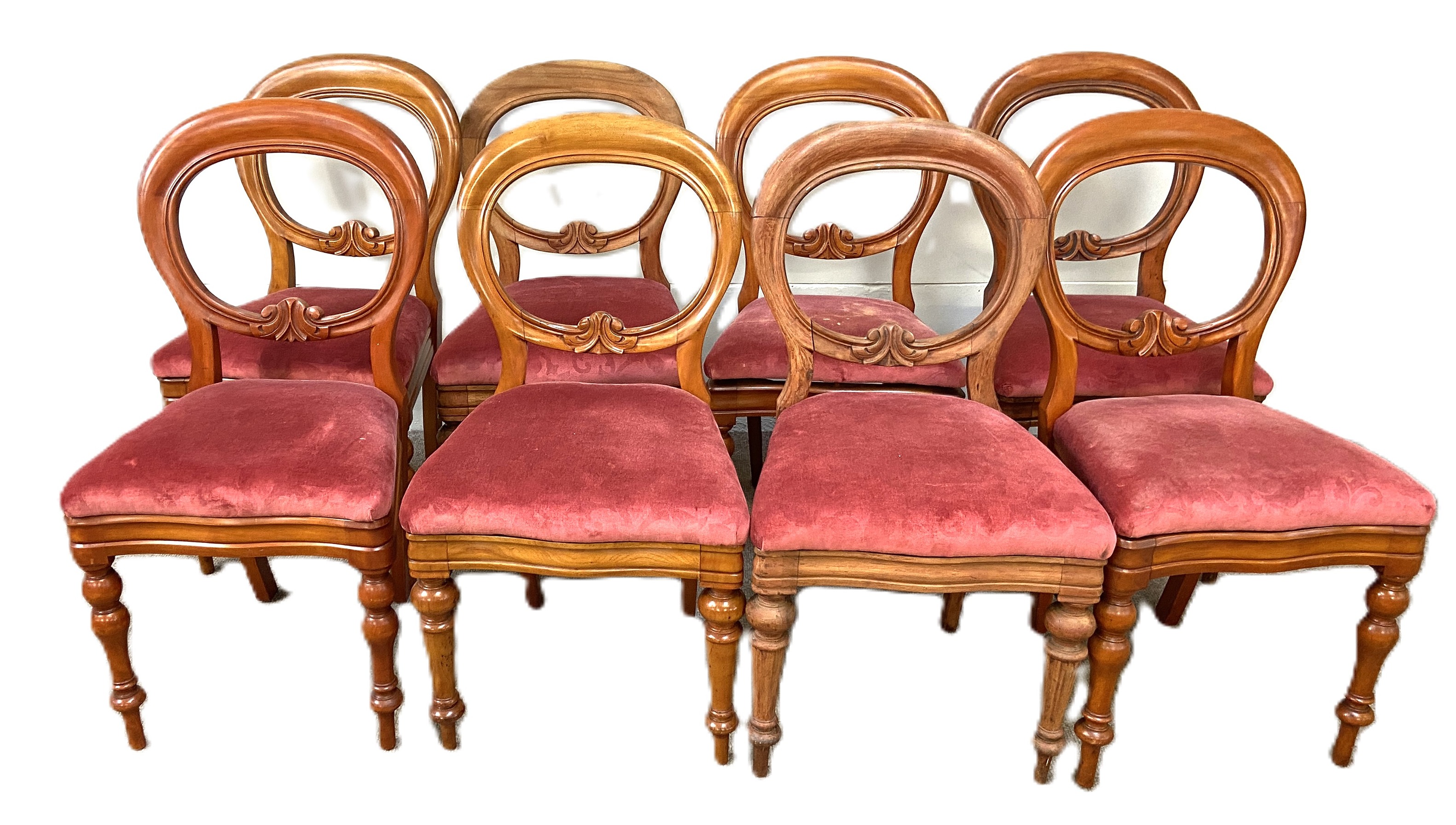A set of Victorian style balloon backed dining chairs, each with a stuffed seat squab, currently