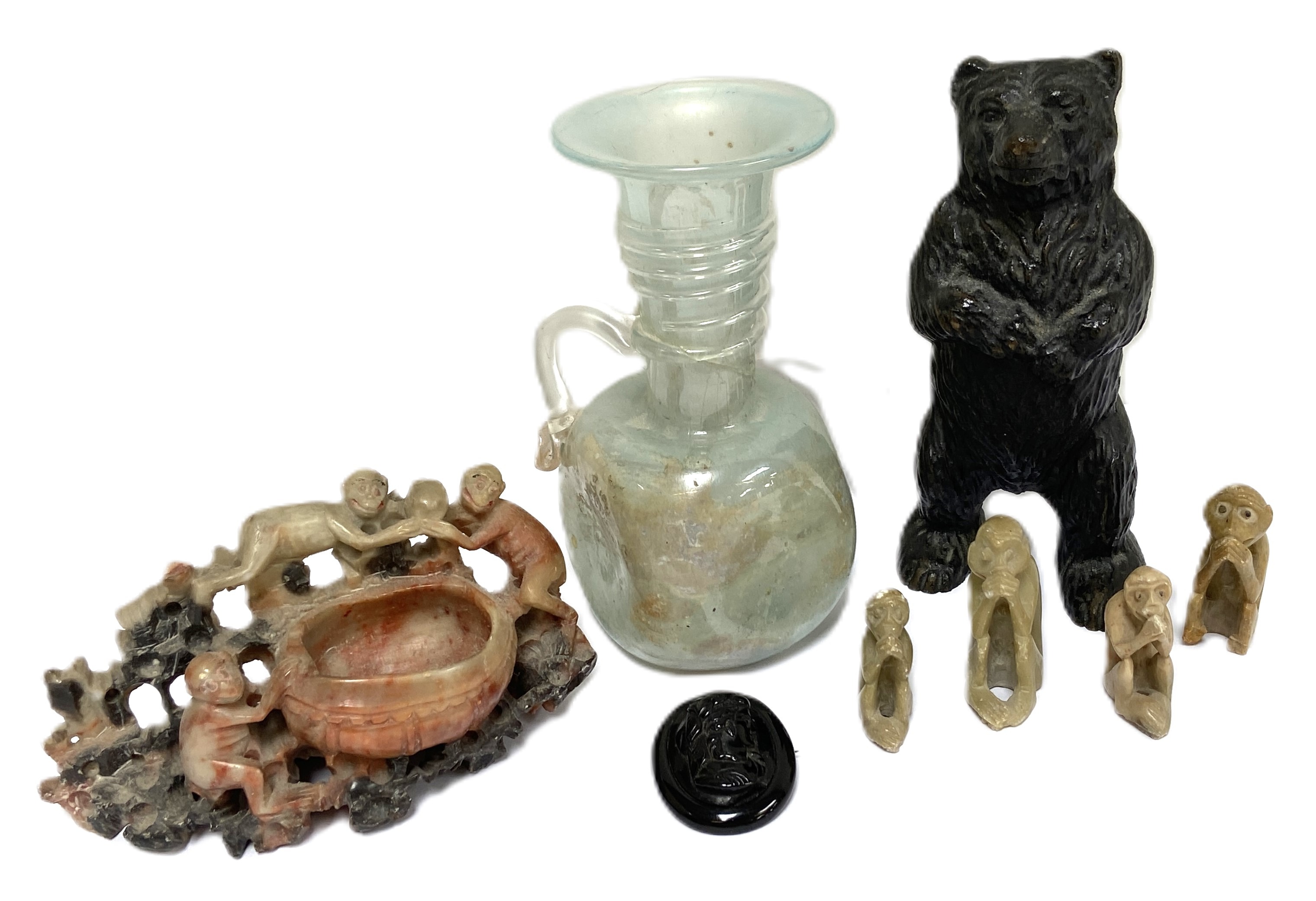 A mixed decorative lot including a cast brass money-box in the form of a standing bear; a Whitby jet