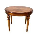 A small circular mahogany veneered coffee table; length 59cm x diameter 66cm x height 53cm