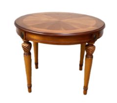 A small circular mahogany veneered coffee table; length 59cm x diameter 66cm x height 53cm