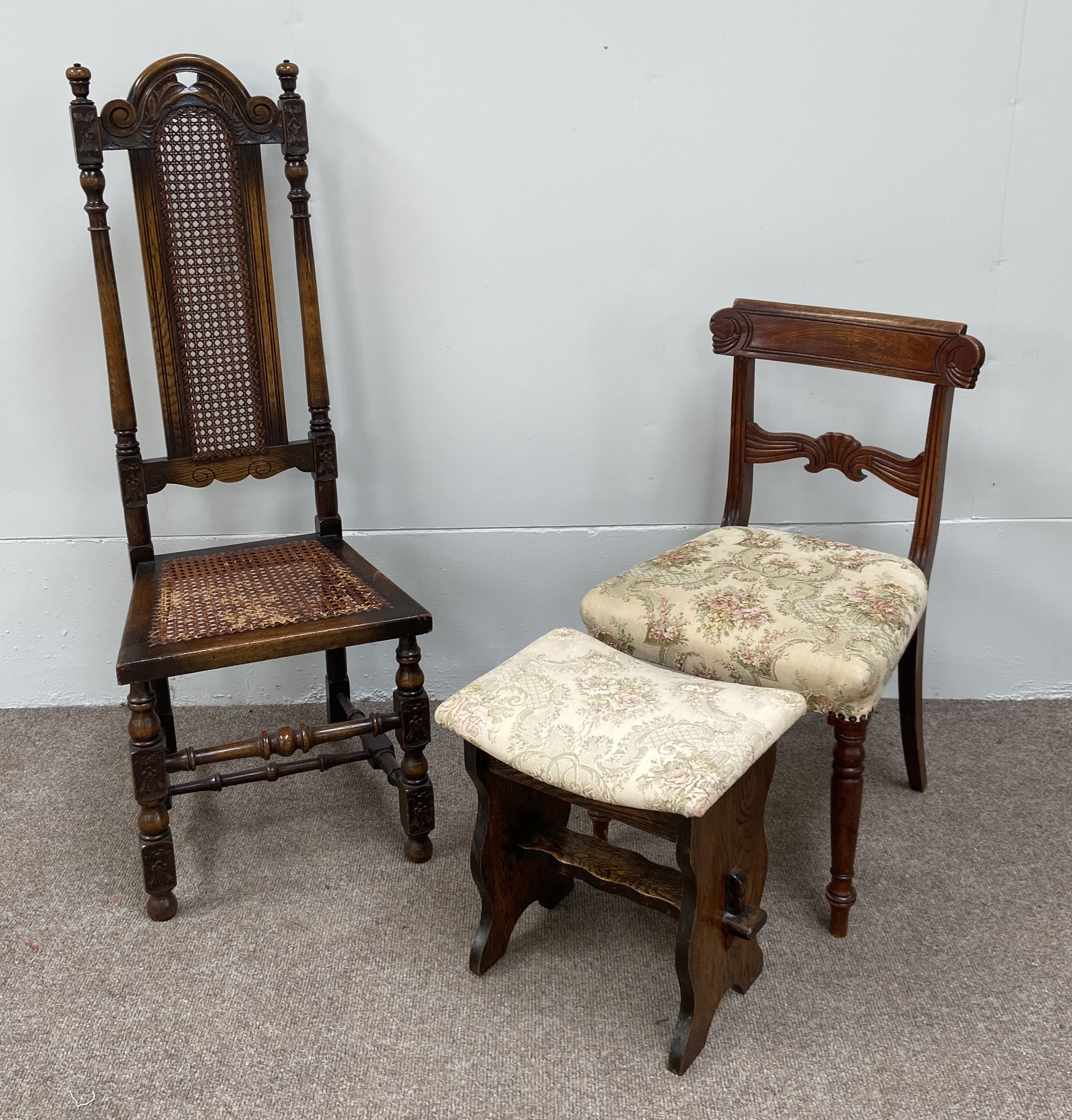An oak Jacobean style hall chair, with caned seat; together with a Regency mahogany dining chair and