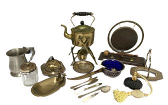 An assortment of metal ware, including a silver plated teapot, a brass hot water jug and stand, a