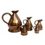 A group of five assorted copper cider measures, 19th century, of typical form, various sizes,
