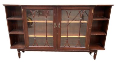 A Georgian style low bookcase, modern, with two glazed bookcase doors flanked by open shelves,