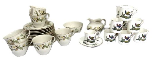 A Royal Worcester bone china part coffee service, decorated with peacocks and pheasants, with 12