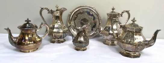 A late Victorian silver plated four piece tea and coffee service; together with a tray and two other