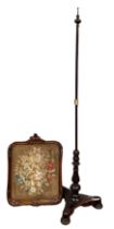 A Victorian rosewood adjustable pole screen, with a moulded frame inset with floral embroidered