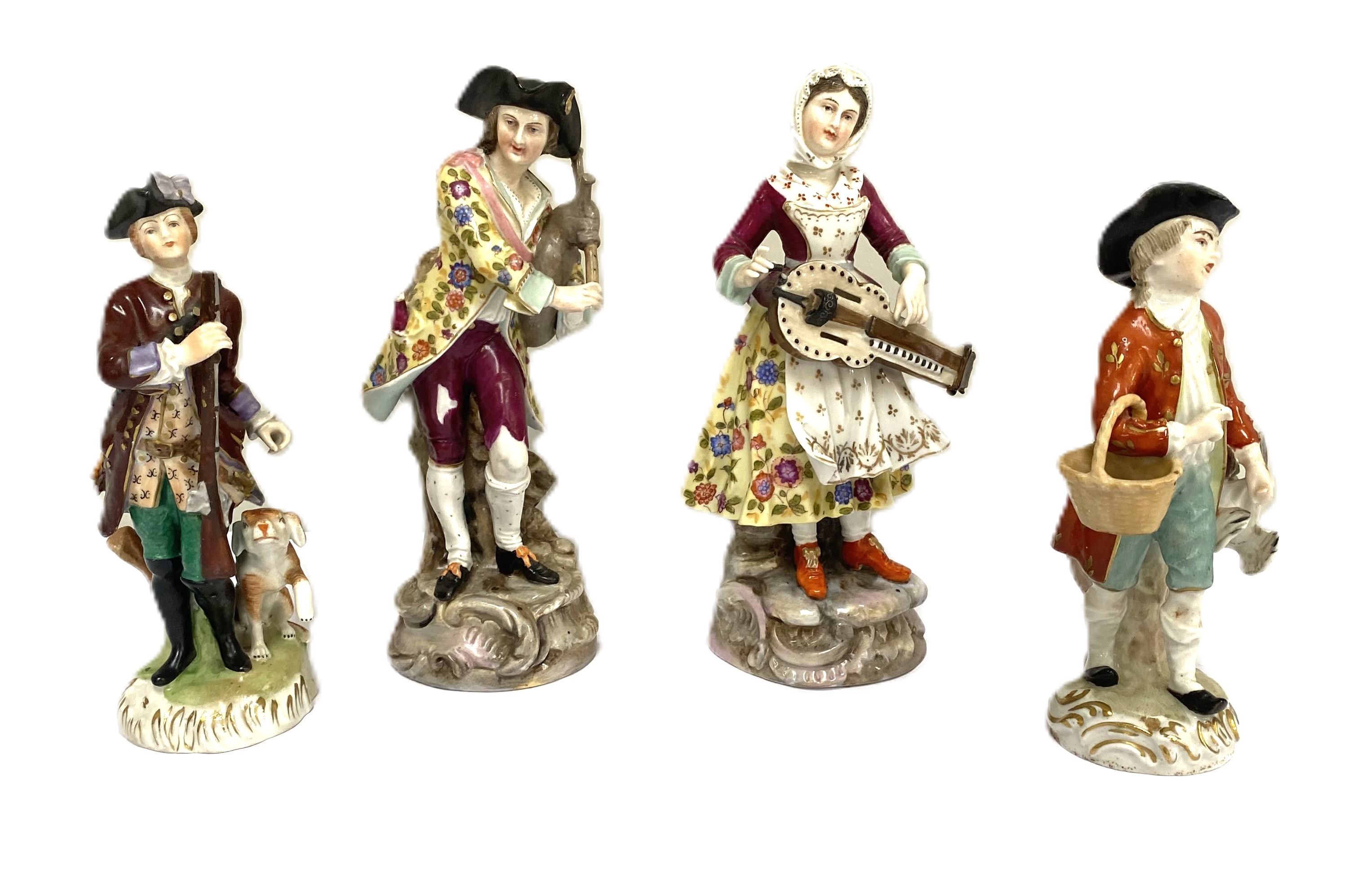 A pair of Dresden porcelain figures of a Lady and Gallant, dressed for hunting, she with a musket
