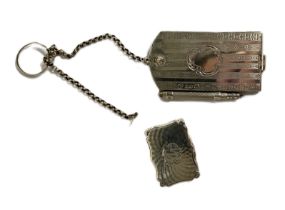 A Victorian silver vinaigrette, by Nathanial Mills, Birmingham 1844, of shaped and hinged form,