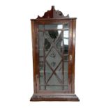 A George III style mahogany wall mounted corner cabinet, with single glazed door.  69cm wide, 41cm