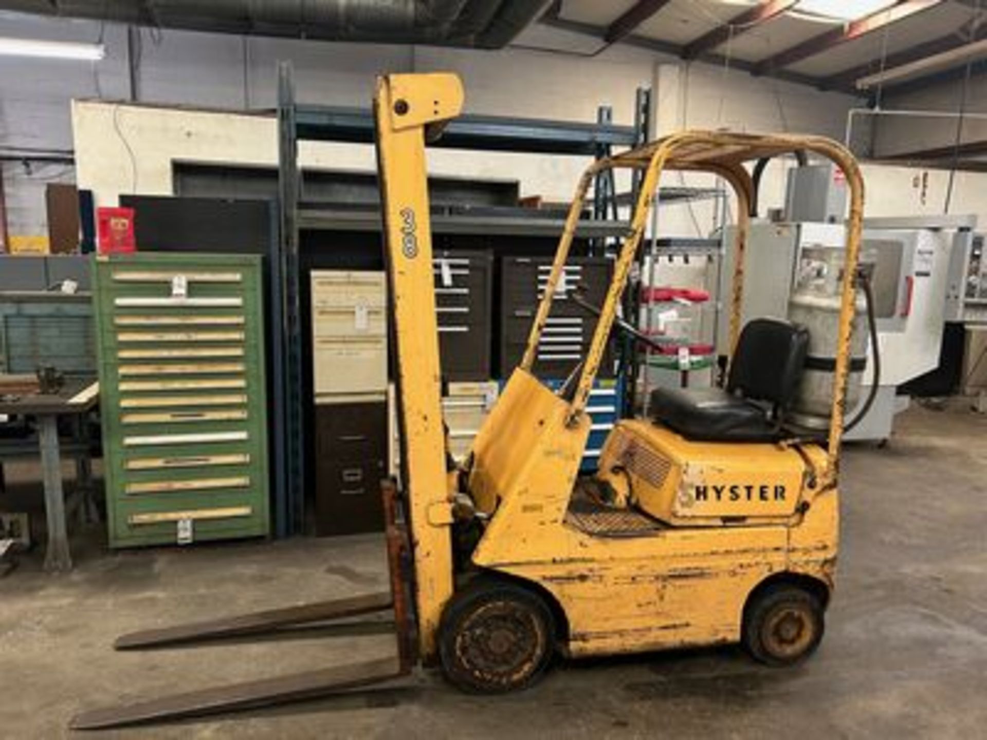 HYSTER LP GAS FORKLIFT, 131" LIFT HT., ROPS, SOLID TIRES, 2,500# CAP., M/N S20A, (0556 HRS)